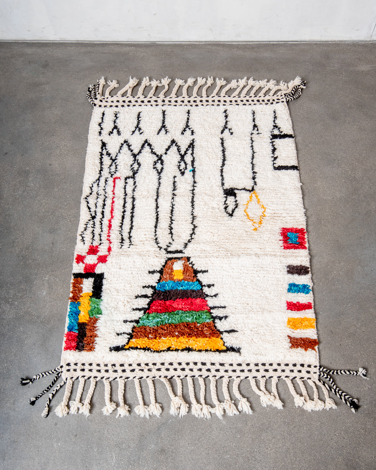 Modern, designer, handcrafted Berber rug from Morocco. Beniourain carpet with beautiful colours and patterns and fluffy wool texture.
